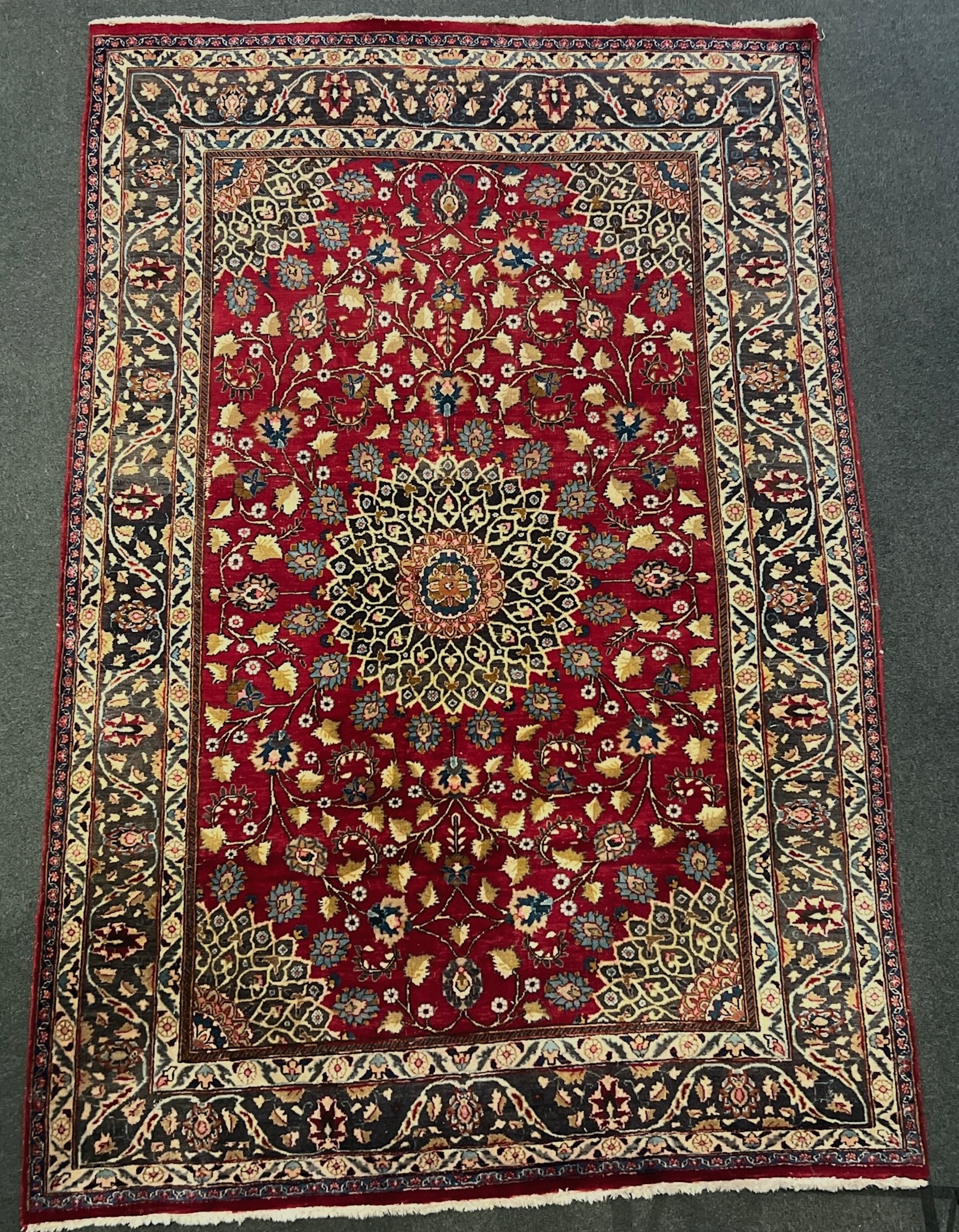 A Tabriz red ground carpet